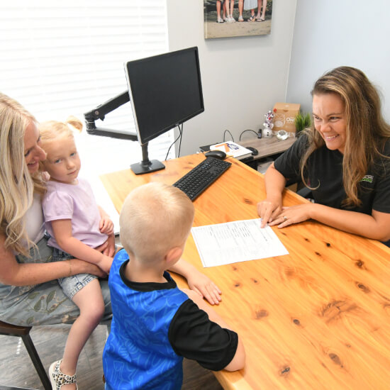Patients checking in at reception