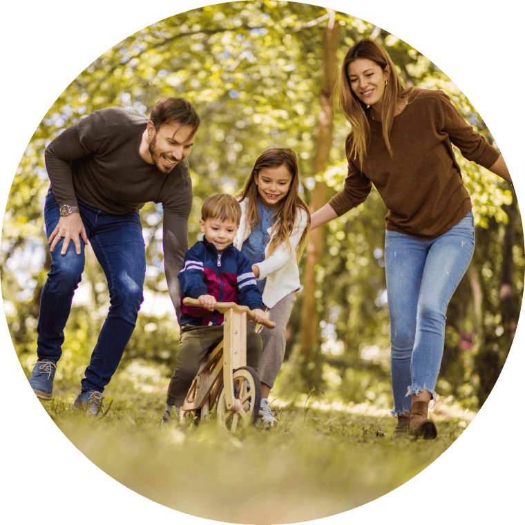 mom and dad teaching kids to ride bicycles