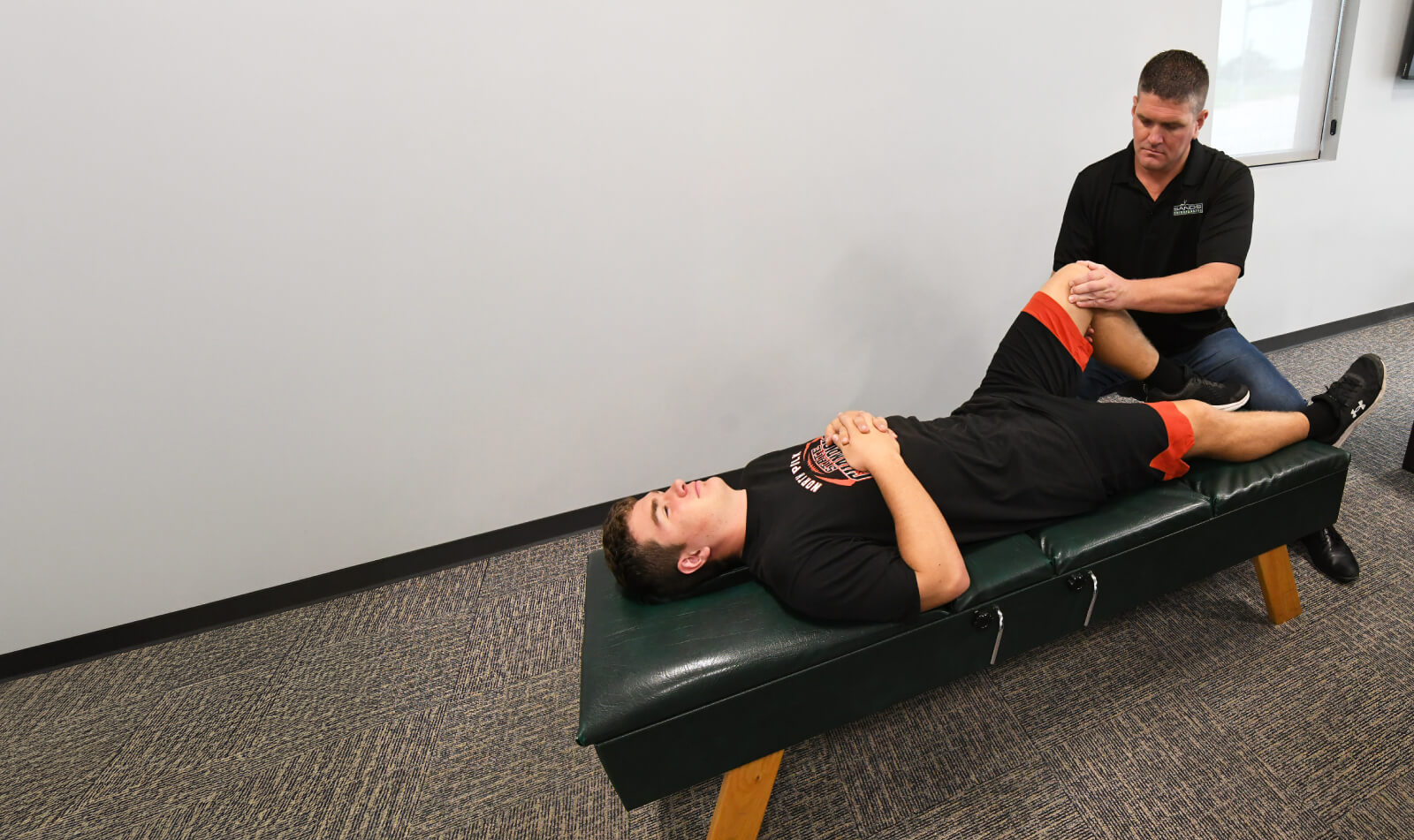 Dr. Justin adjusting patient