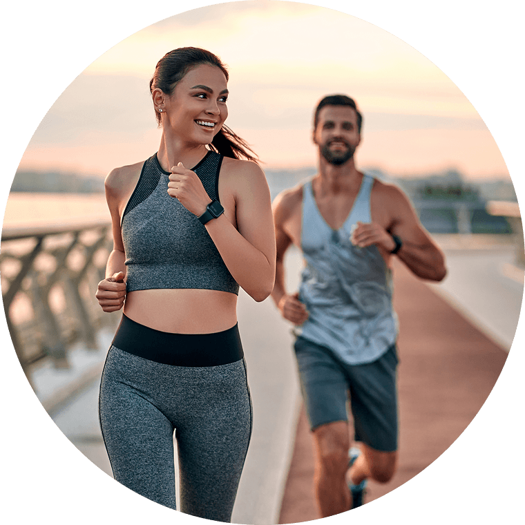 man and woman jogging outdoors