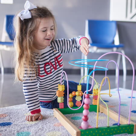 Child playing in OpenDoor Chiropractic play area