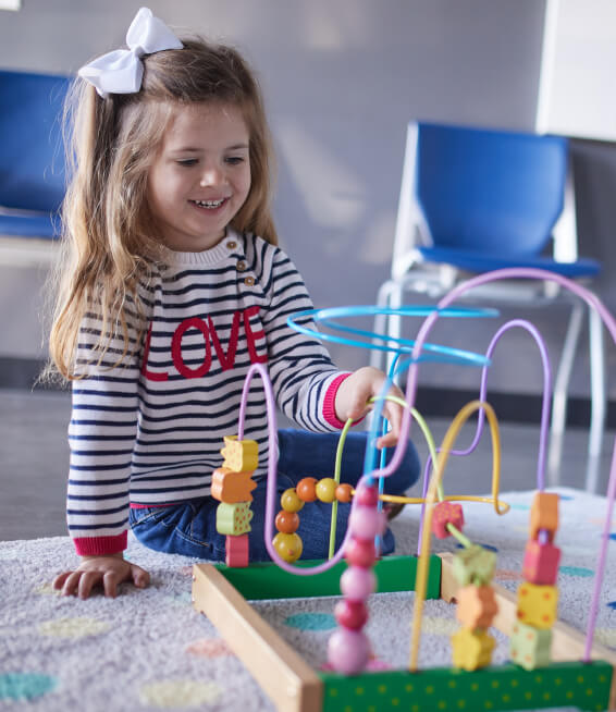 Omaha child playing with toys at OpenDoor Chiropractic