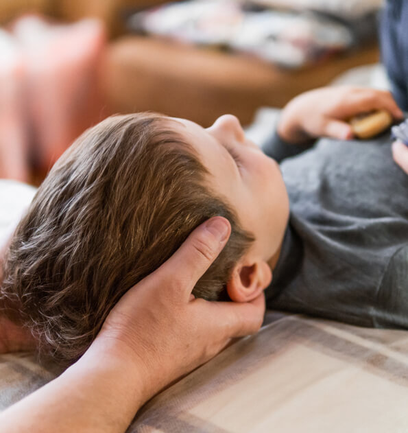 Chiropractor adjusting a little boy