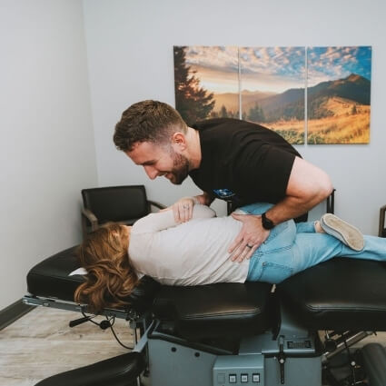 Dr Dotson adjusting womans back