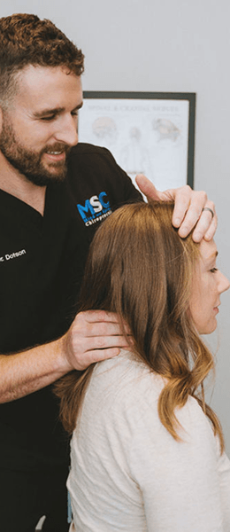 Mind and Spine Chiropractic patient having neck adjusted