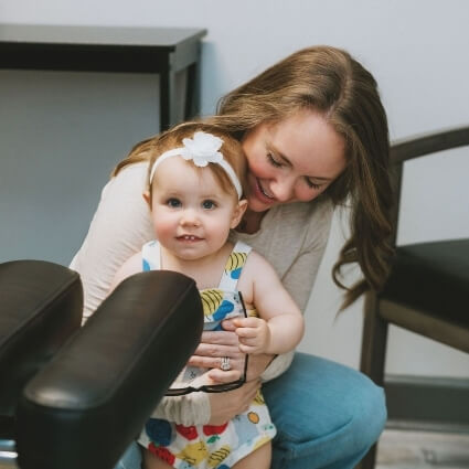 mom and kid in our office