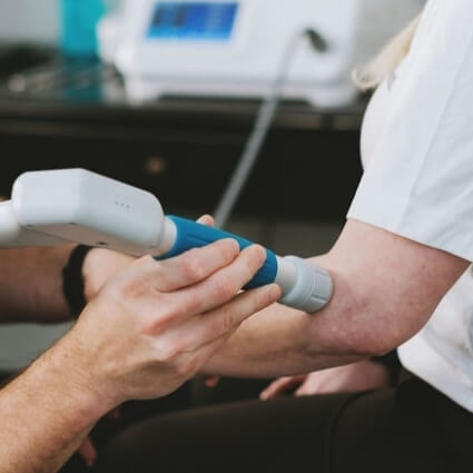 soft tissue therapy on womans arm