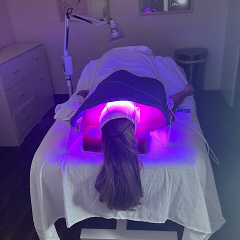 Female patient treated with Red Light Therapy
