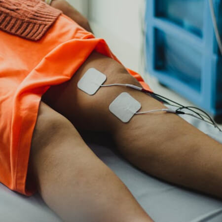 Female patient treated with e-stim