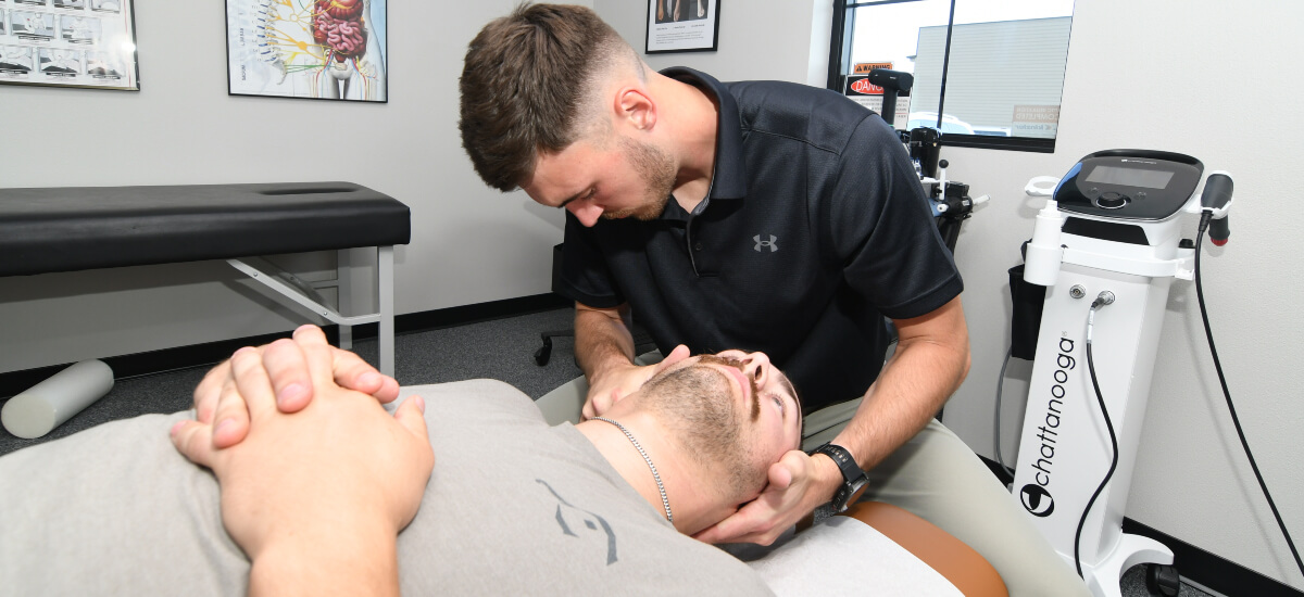 Gilbert chiropractor treating a patient's neck