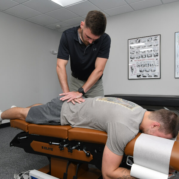 Lower-back adjustment for male patient