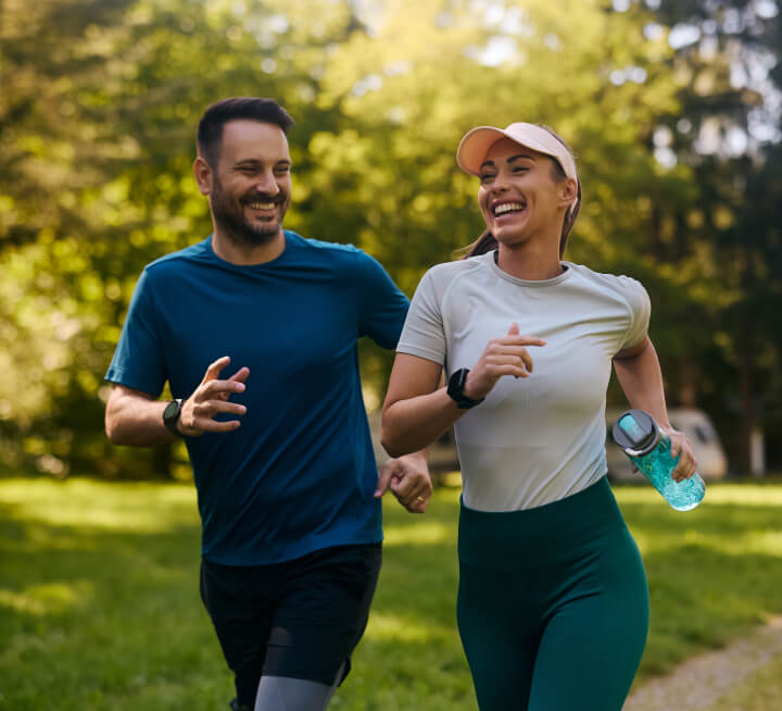 Smiling male and female joggers