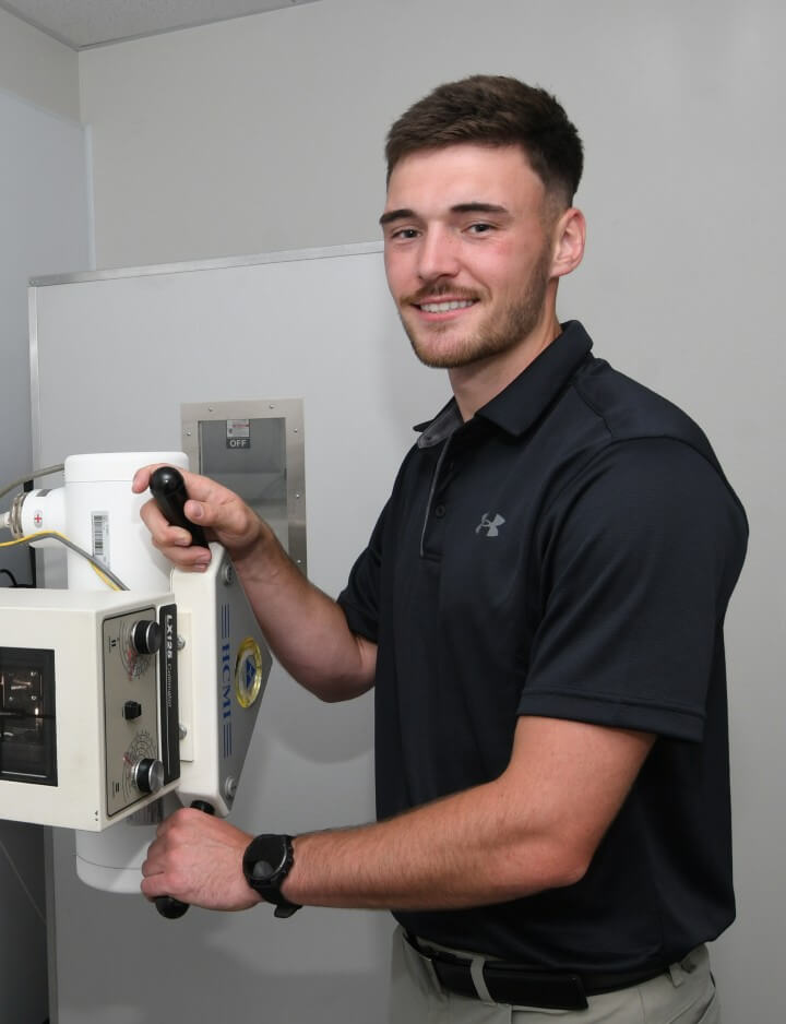 Dr Alex operating the machine