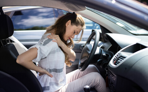 Woman in pain after car accident