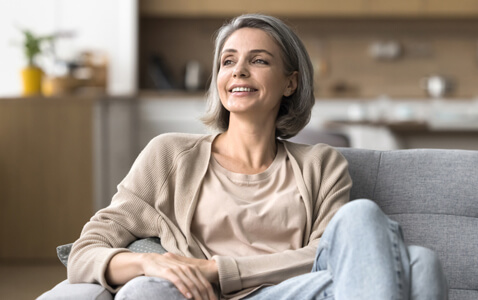 Smiling woman sitting on a couch