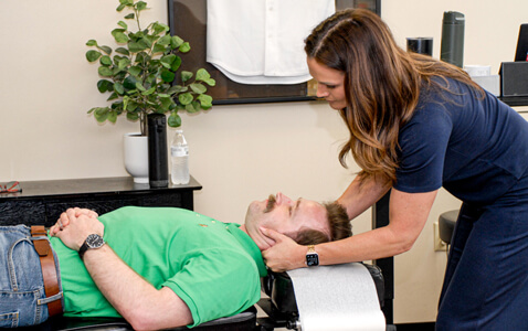 Patient receiving a neck adjustment