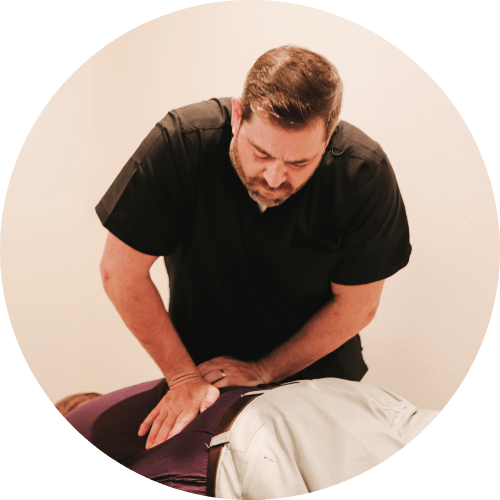 Allen chiropractor Dr Michael adjusting patients back