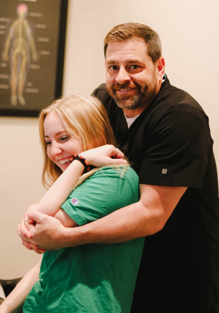 Allen chiropractor Dr Michael adjusting patient