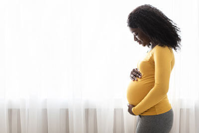 pregnant-woman-near-window