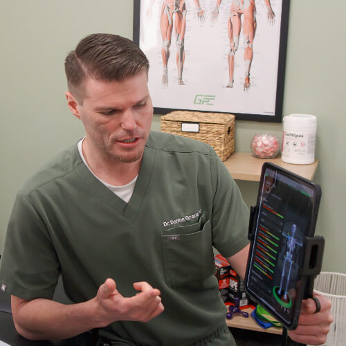 Chiropractor pointing at x-ray