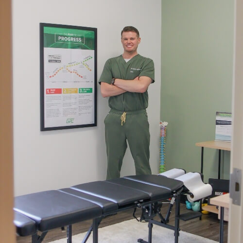 Dr. Dalton Grant standing in chiropractic treatment room