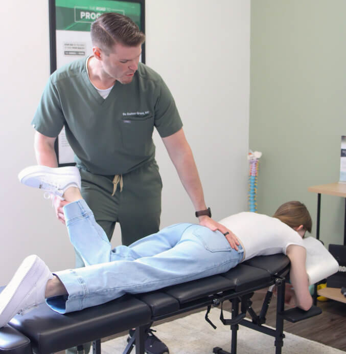 Dr. Daltona adjusting patient 