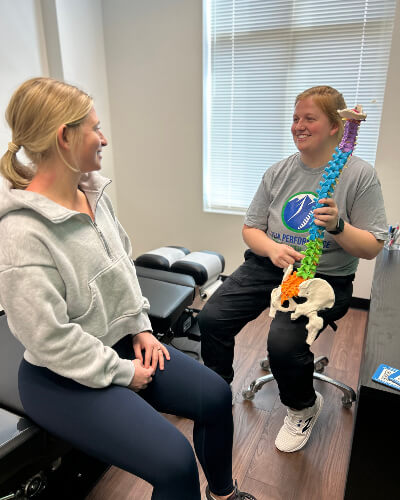 Doctor holding spine model