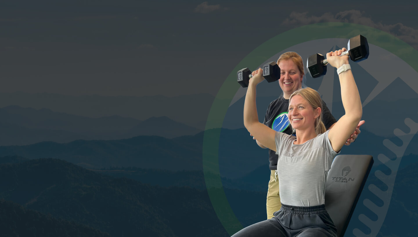 Woman lifting weights with doctor