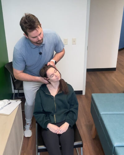 Burnsville Chiropractor doing neck adjustment