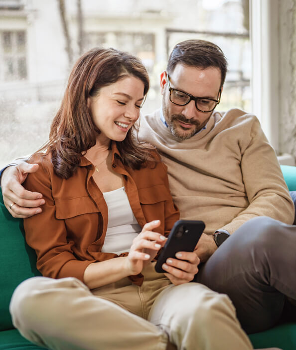 Couple looking at phone