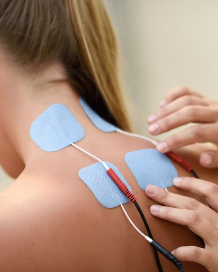 e-stim pads on womans neck
