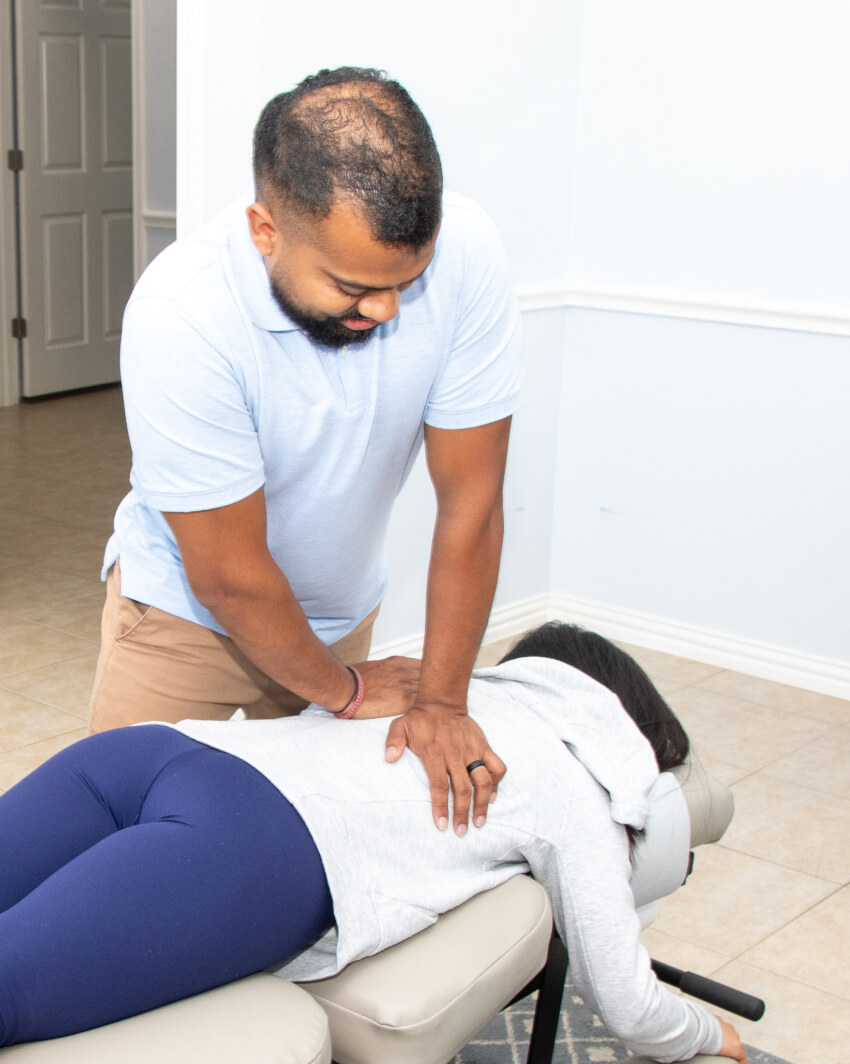 Resolve Chiropractic and Wellness patient having back adjusted