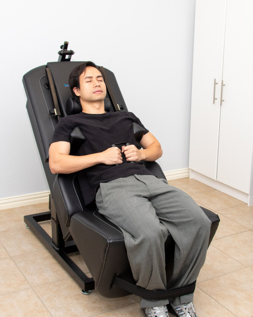 Resolve Chiropractic and Wellness patient on decompression machine