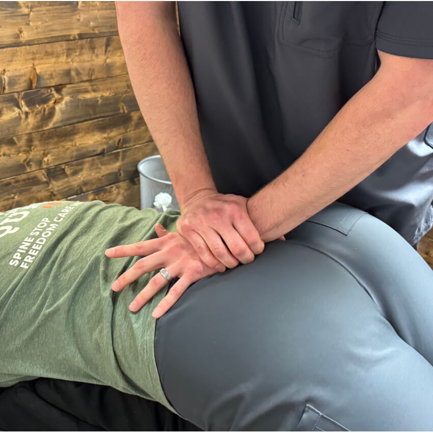 patient having back adjusted