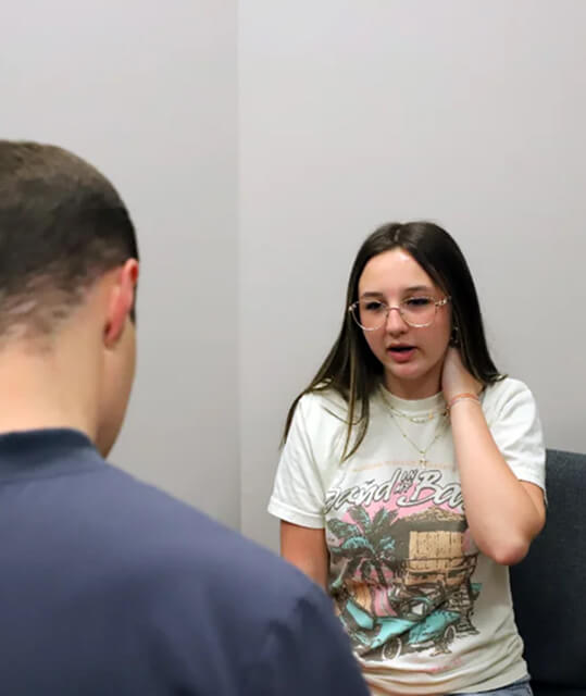 patient talking to Bowling Green chiropractor