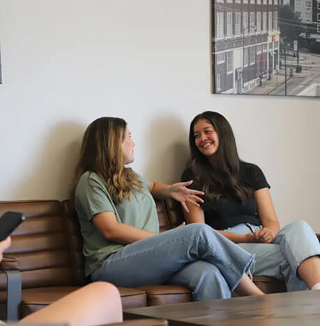 patients chatting in the Spine Stop Chiropractic waiting area
