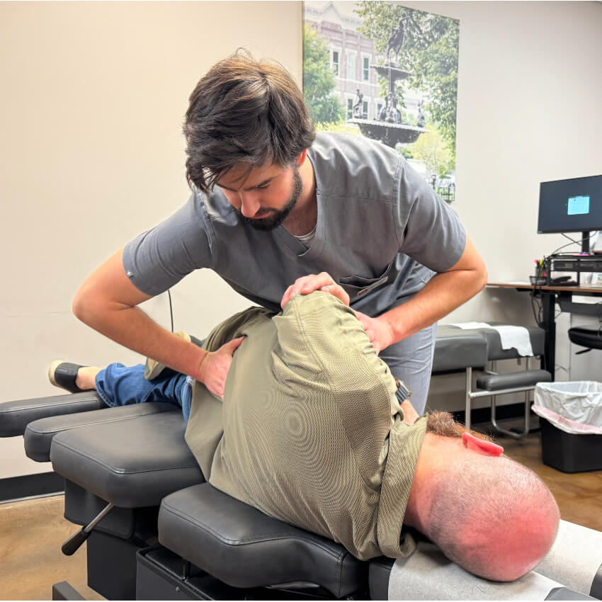 patient having back adjusted