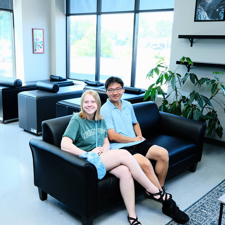 two patients sitting together in the Blaine Family Chiropractic waiting area