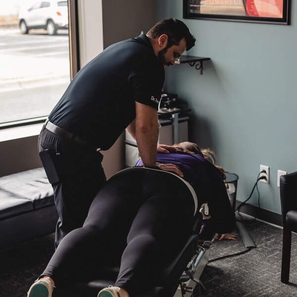 Anoka chiropractor adjusting a female patient