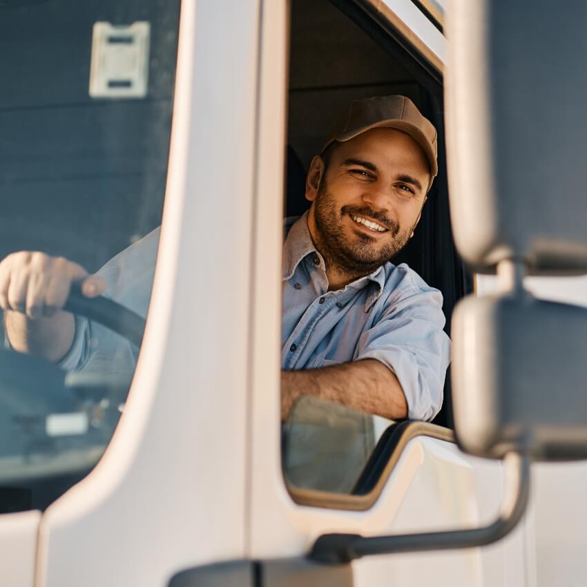 truck driver smiling while driving