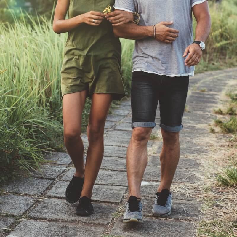 a couple walking outdoors
