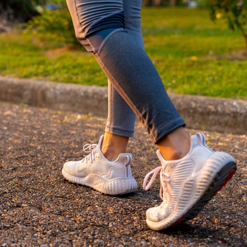 woman walking outdoors on a road