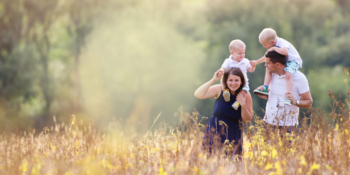 family walking in a field