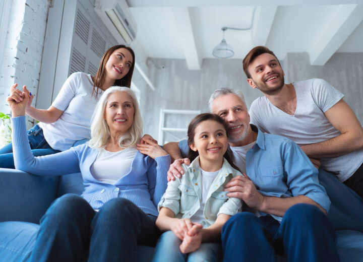 multiple generations sitting on couch