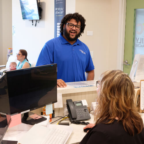 Patients checking in at front desk