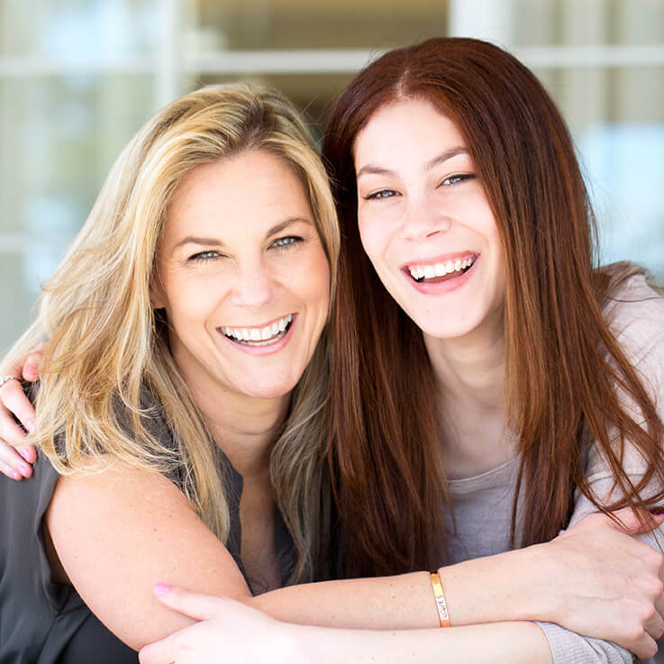 two ladies smiling