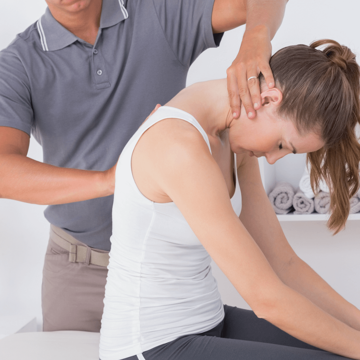 chiropractor adjusting back