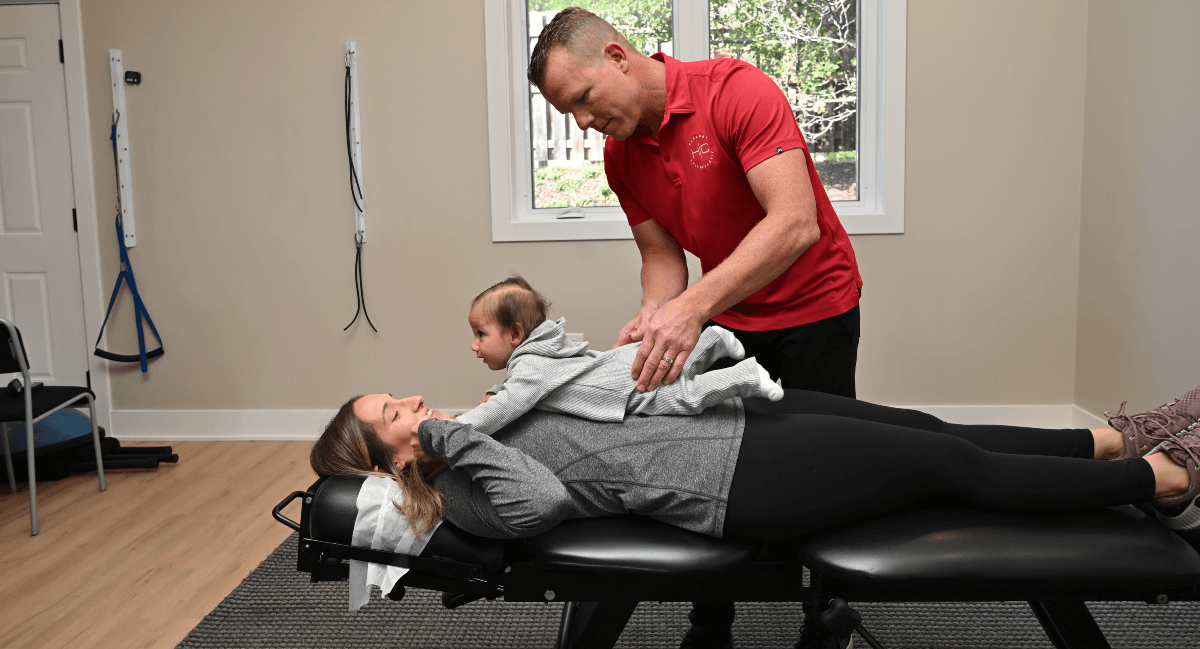 South Elgin chiropractor adjusting pediatric patient's back