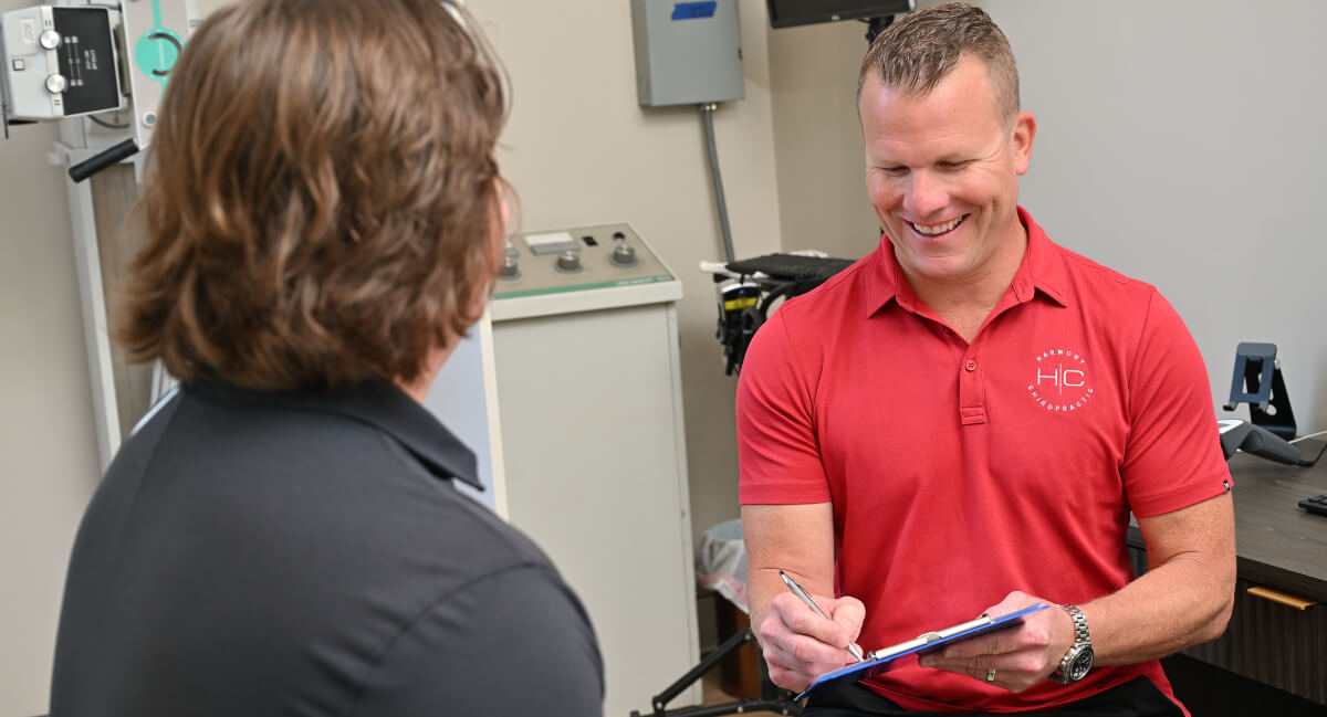 South Elgin chiropractor in discussion with patient