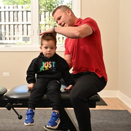 Pediatric patient in a consultation with a chiropractor